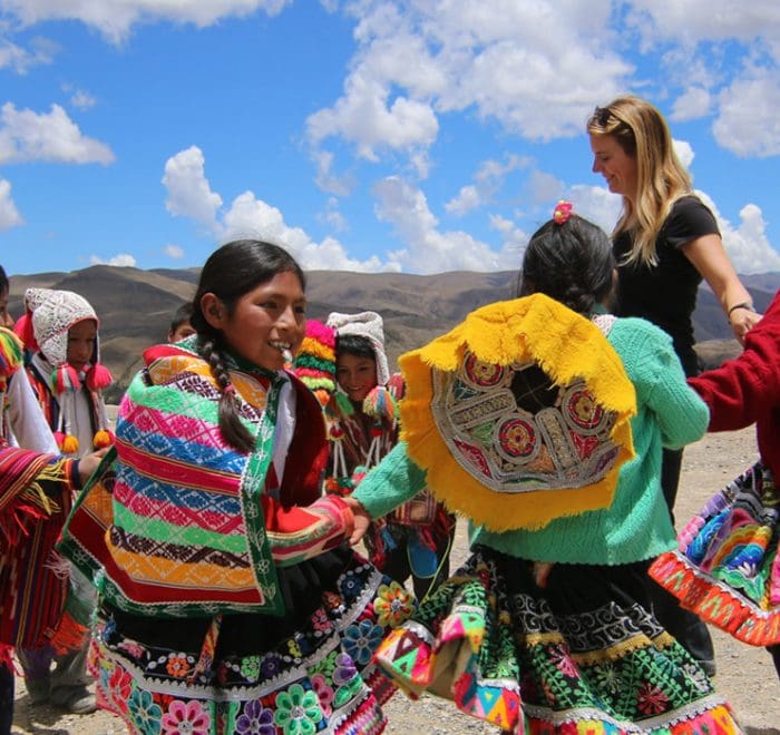 A group of people in colorful clothing dancing.