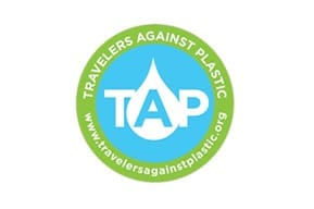 A blue and green logo for travelers against plastic.